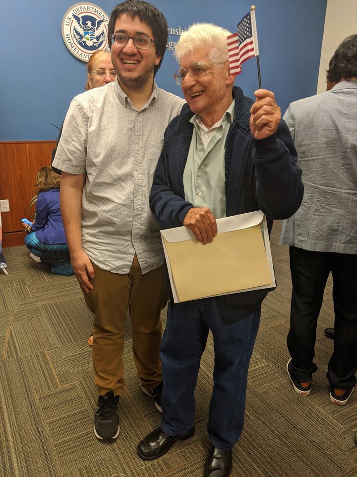 My grandfather and I in Florida after his naturalization ceremony. He is holding a small American flag.